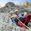 Un papa et son fils parcourant la voie de Via ferrata d'Aillon-le-Jeune